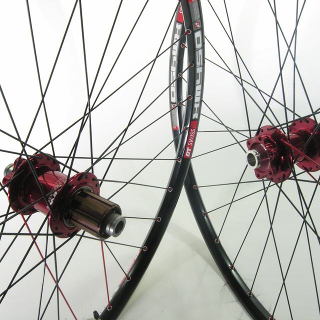 Custom wheel: Chris King ISO Red hubs, DT Xm450 Black rims, Sapim Race Black spokes