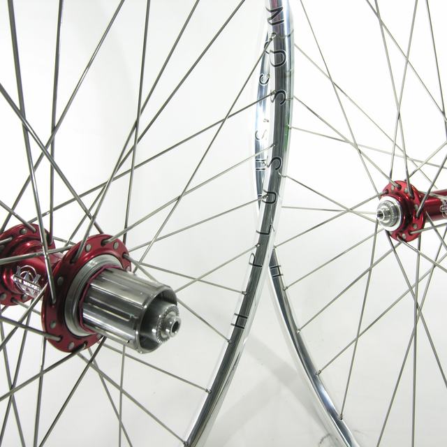 Custom wheel: White Industries T11 Red hubs, H Plus Son Archetype Polished rims, Sapim CX-Ray Silver spokes