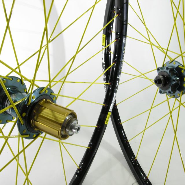Custom wheel: Hope Pro 2 Evo Gun Metal hubs, Mavic En821 Black rims, WTB Yellow spokes