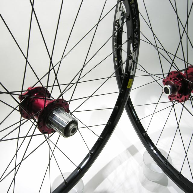 Custom wheel: Chris King ISO Red hubs, Mavic Ex823 Black rims, DT Competition Black spokes