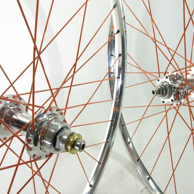 Custom wheel: Paul Word Disc Polished hubs, Velo Orange Polished rims, PWB Orange spokes