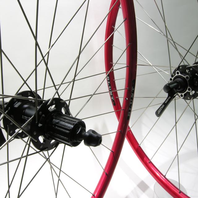 Custom wheel: Shimano XT 756 Black hubs, Velocity Blunt Red rims, DT Champion Silver spokes