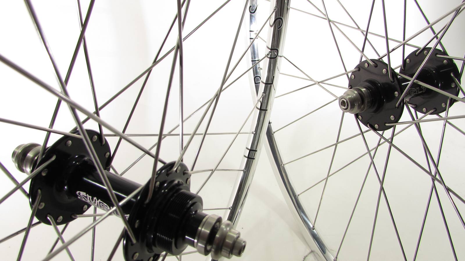 Custom wheel built by ProWheelBuilder: Surly Ultra New Black hubs, H Plus Son Archetype Polished rims