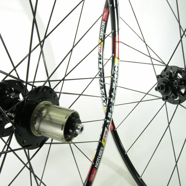 Custom wheel: Velocity 130 SL Disc Black hubs, Stan's Alpha 400 Black rims, Sapim Race Black spokes