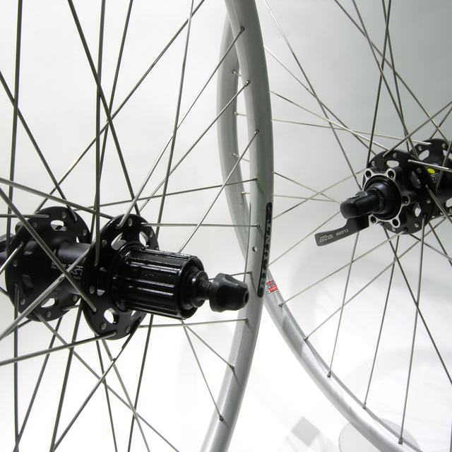 Custom wheel: Shimano XT 756 Black hubs, Velocity Blunt Silver rims, DT Champion Silver spokes
