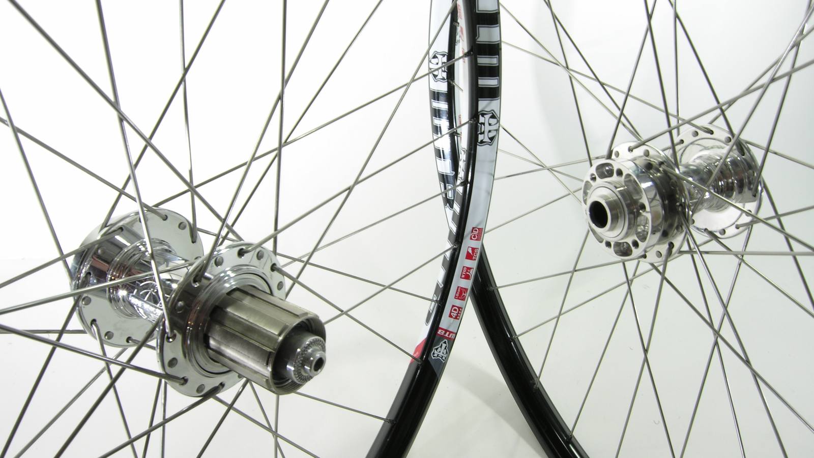 Custom wheel built by ProWheelBuilder: White Industries Mi6 Polished hubs, WTB I25 Black rims