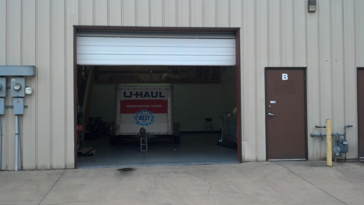 U-Haul trailer unloading inside the new Cumming, Georgia building