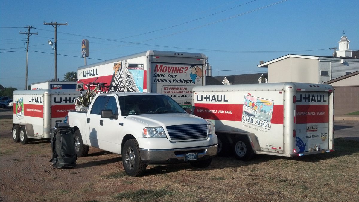 The moving convoy: pickup truck and U-Haul trailers on the road from Las Vegas to Georgia