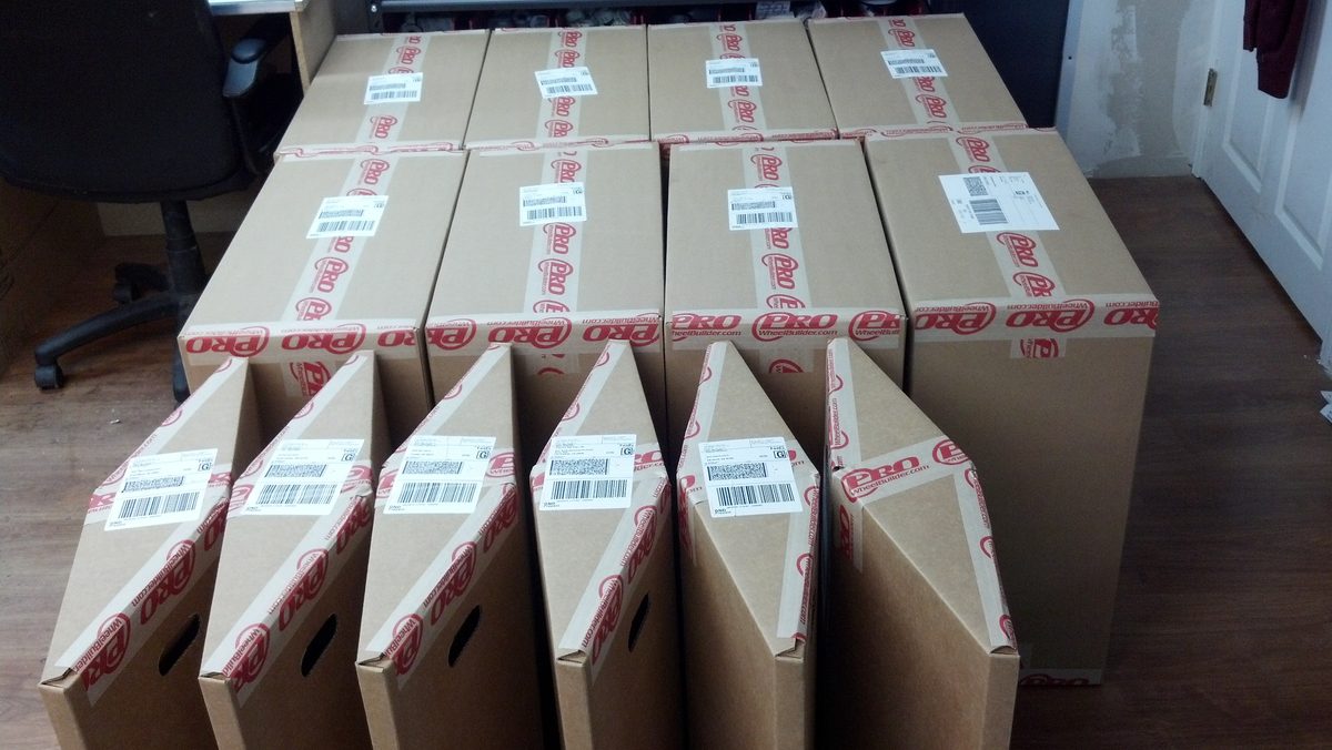 A day's worth of finished wheels boxed in ProWheelBuilder shipping boxes