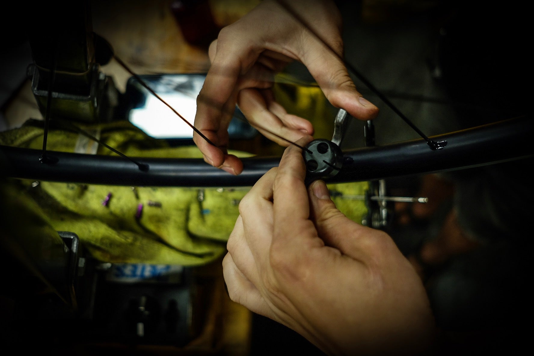 Hand wheel-building at Velocity USA (About Us page)